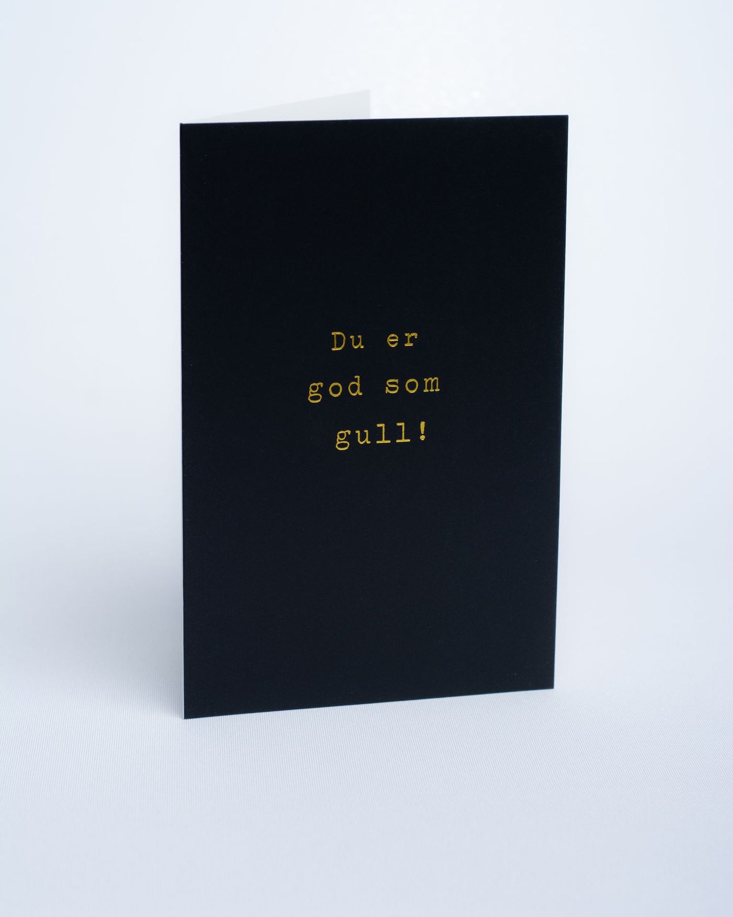 Dobbel kort I sort farge med gull tekst. Portfoliofoto